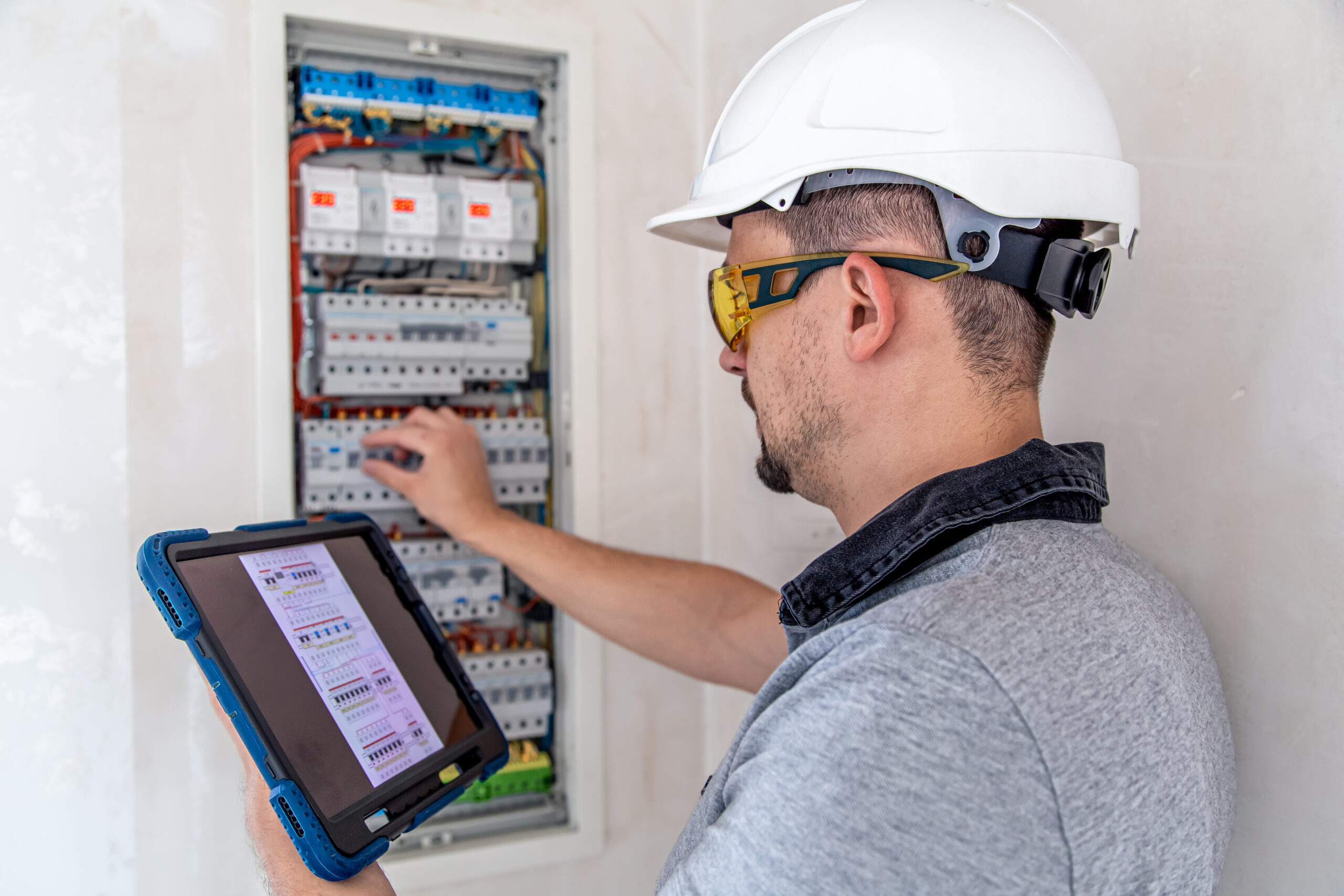 Electrician inspecting a home electrical panel in Port Charlotte.