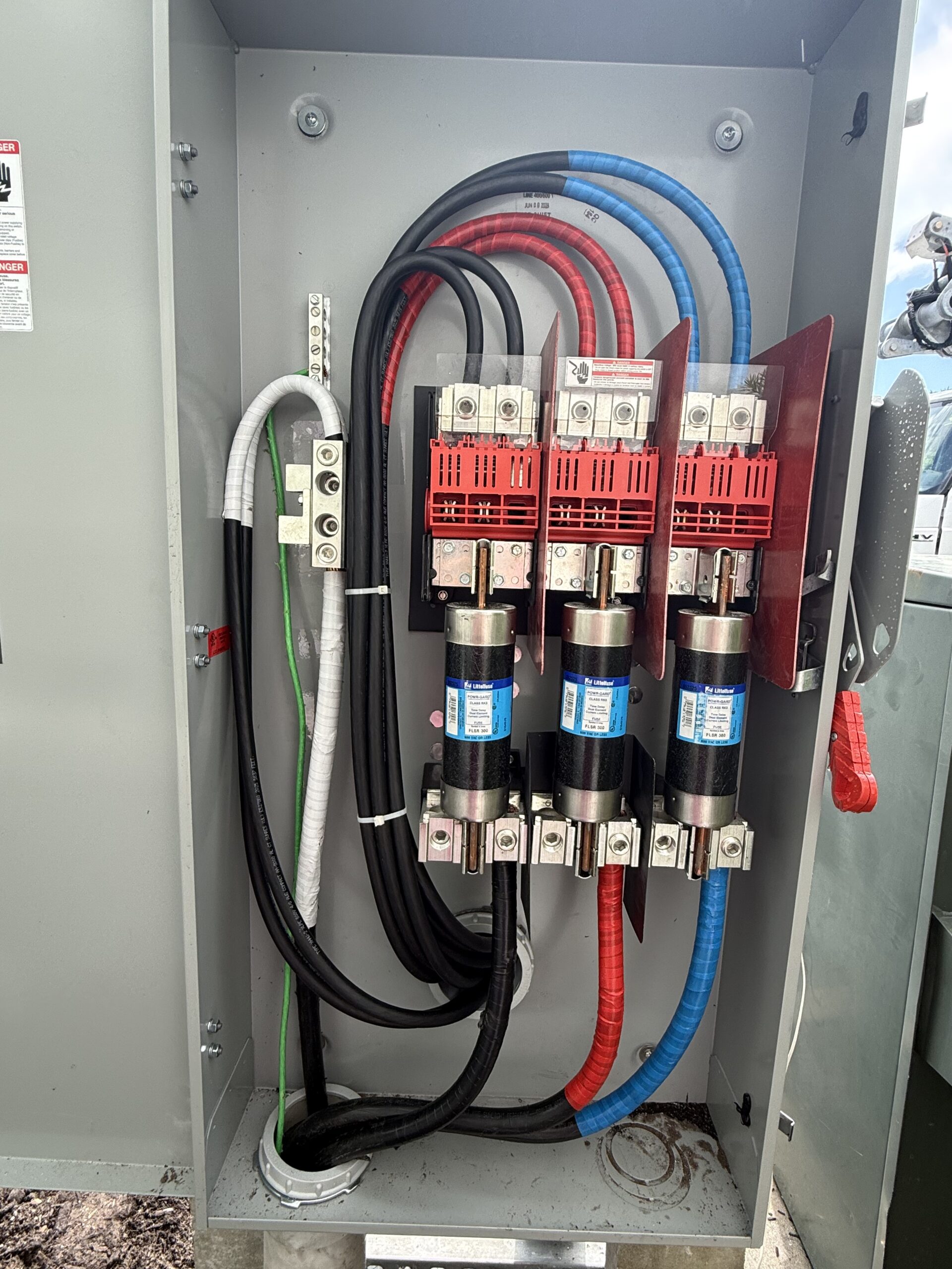 Licensed Bartow electrician inspecting residential electrical panel for safety